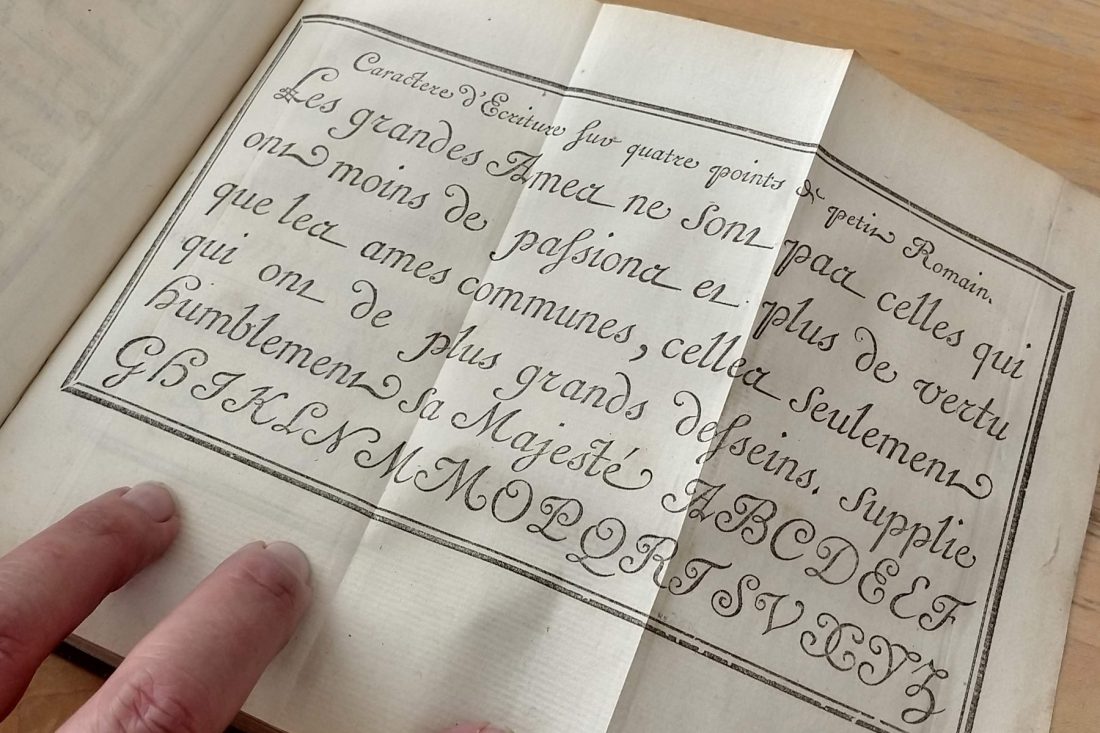 Close up photo of type specimen book; Letterform Archive, San Francisco