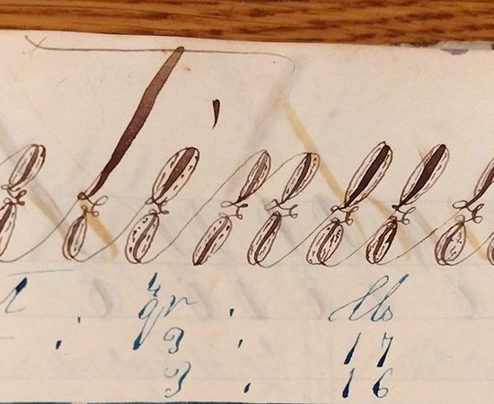 Detail of ornate handwritten word "Continued" from 1859 math workbook of William D. Linebaugh