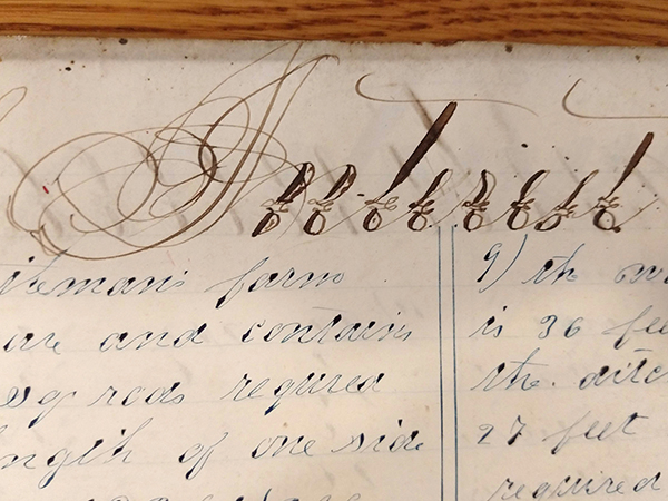 Detail of ornate handwritten word "Interest" from 1859 math workbook of William D. Linebaugh