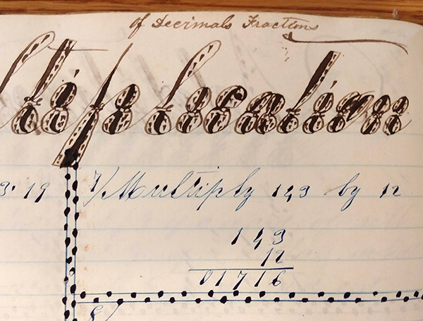 Detail of ornate handwritten word "Multiplication" from 1859 math workbook of William D. Linebaugh