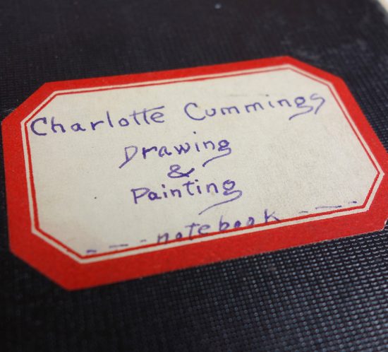 handwritten nameplate on class notebook: reads "Charlotte Cummings, Drawing & Painting, Notebook"