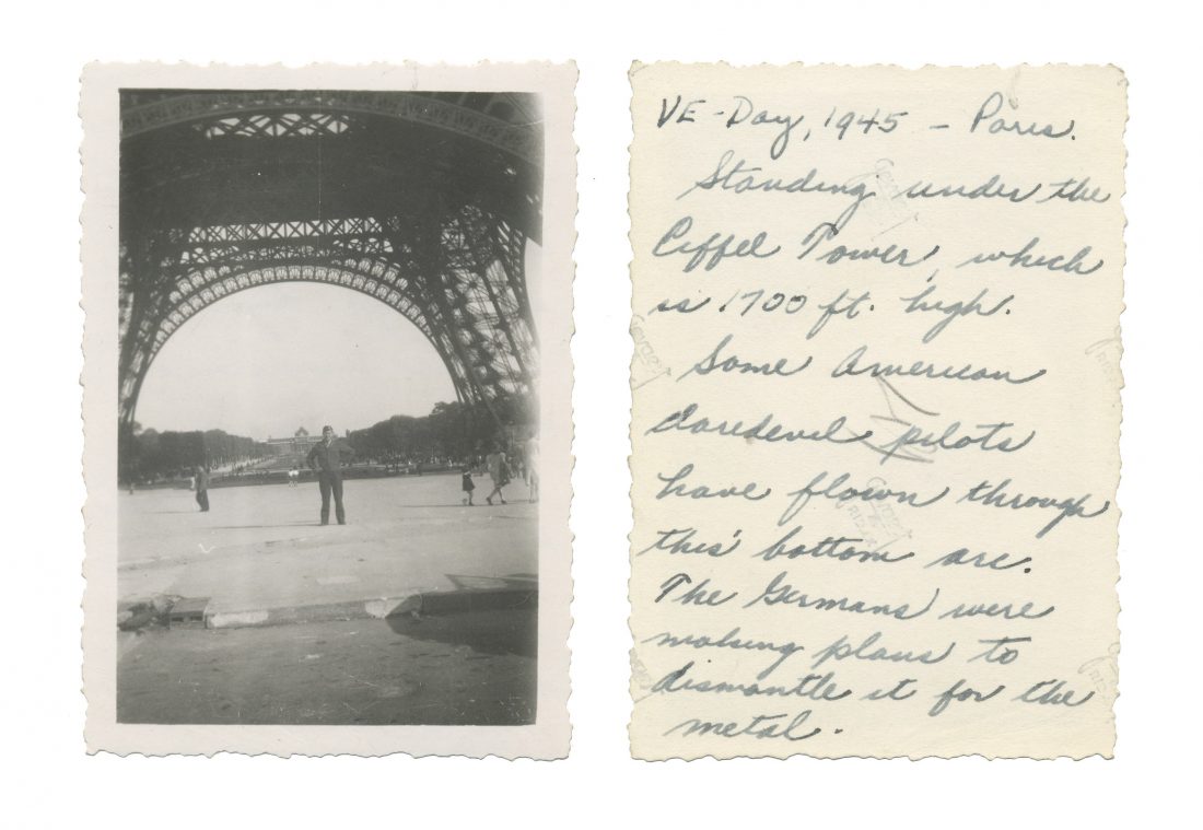 Photo taken on VE Day in Paris; shows US intelligence officer Lewis J. Nescott standing underneath the Eiffel Tower