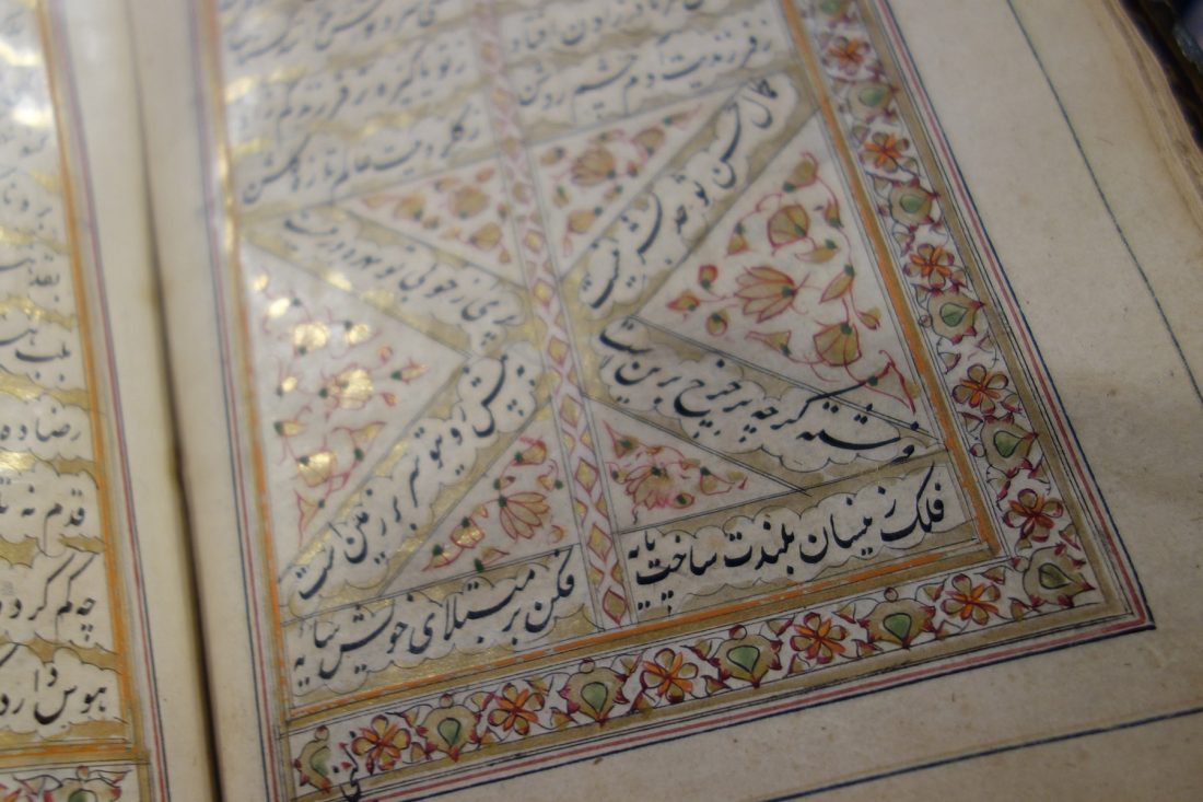 Close up photo of book hand lettered in Arabic; Letterform Archive, San Francisco