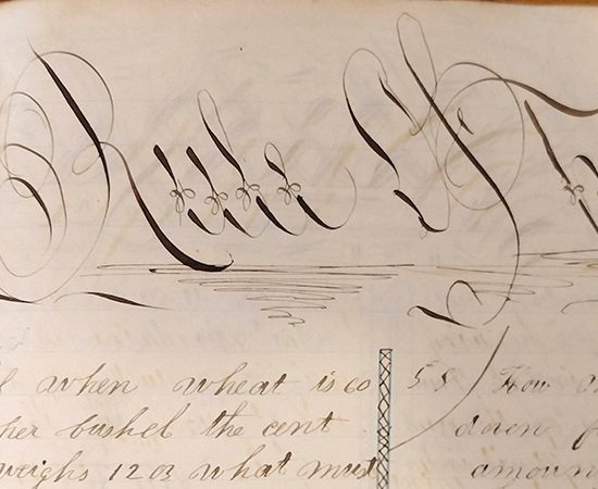 Detail of ornate handwritten word "Rule of Three" from 1859 math workbook of William D. Linebaugh